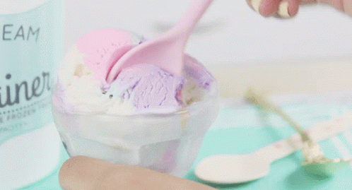 A Bowl Of Ice Cream With A Label That Says " Cream " GIF
