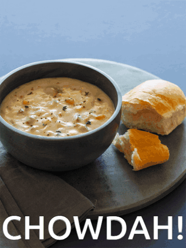 A Bowl Of Soup With A Piece Of Bread Next To It And The Words Chowdah Above It GIF
