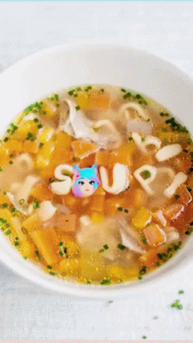 a bowl of soup with the word soup written on the top