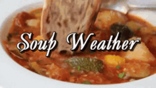a bowl of soup with the words soup weather written above it