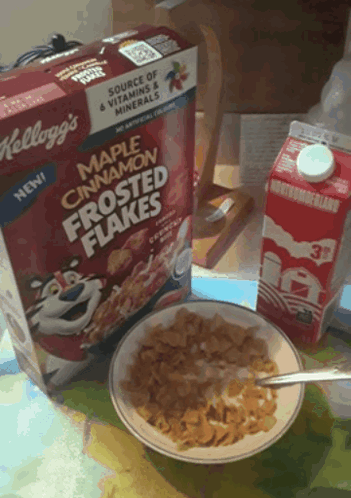 a box of maple cinnamon frosted flakes sits next to a bowl of cereal