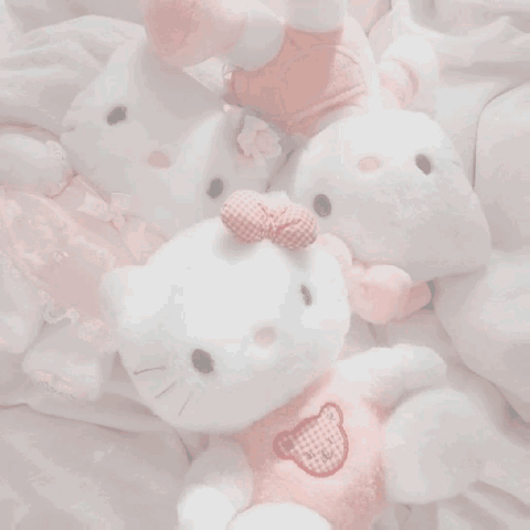 A Box Of Pink Cakes With Strawberries On Top GIF