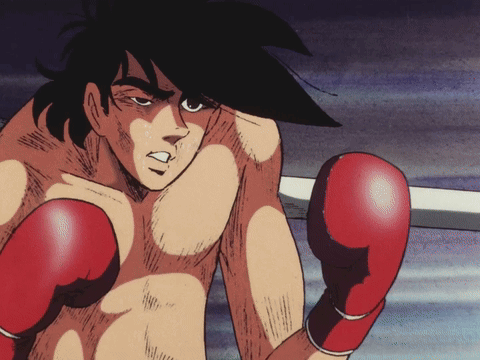 A Boxer In A Ring With Red Gloves On His Hands GIF