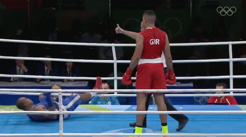 A Boxer Wearing A Red Shirt With The Letter G On It GIF