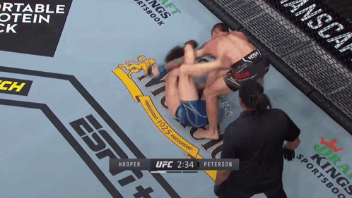 A Boxing Match Between Hooper And Peterson Is Being Broadcast On Espn GIF