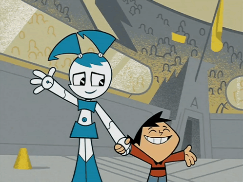 A Boy And A Girl Are Holding Hands In Front Of A Building With A Letter A On It GIF
