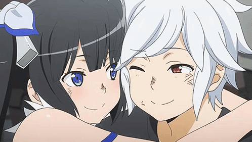 A Boy And A Girl Are Hugging Each Other And Looking At Each Other . GIF
