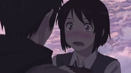 A Boy And A Girl Are Hugging Each Other And Looking At Each Other . GIF