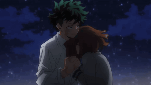 A Boy And A Girl Are Hugging Each Other In The Dark GIF