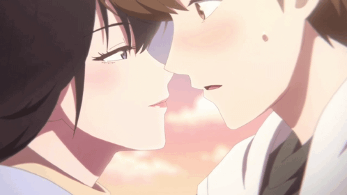A Boy And A Girl Are Kissing In A Close Up Of Their Faces GIF