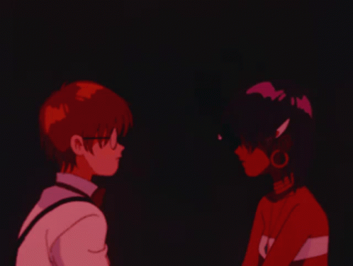A Boy And A Girl Are Looking At Each Other And The Girl Is Wearing A Shirt That Says Sai GIF
