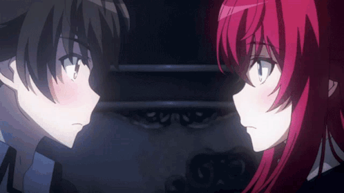 A Boy And A Girl Are Looking At Each Other With Their Eyes Closed GIF