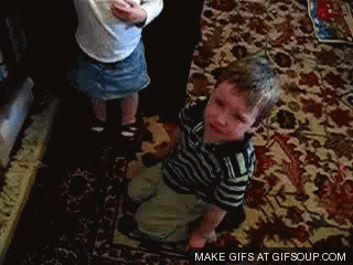a boy and a girl are playing on a rug with the words make gifs at gifsoup.com