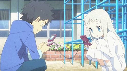 A Boy And A Girl Are Playing With A Video Game GIF