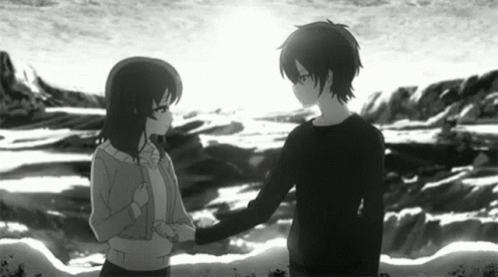 A Boy And A Girl Are Shaking Hands In Front Of A Body Of Water . GIF