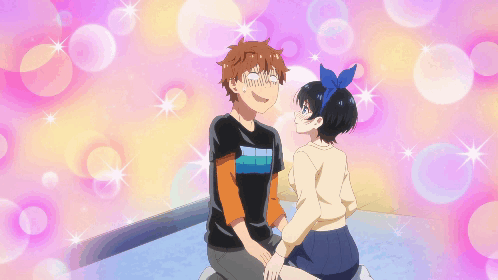 A Boy And A Girl Are Sitting Next To Each Other And The Girl Has A Blue Bow In Her Hair GIF