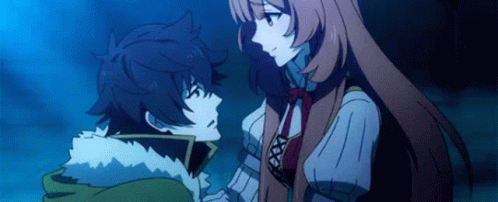 A Boy And A Girl Are Standing Next To Each Other And Looking At Each Other In A Dark Room . GIF