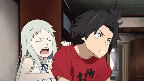 A Boy And A Girl Are Standing Next To Each Other And The Boy Is Wearing A Red Shirt With Chinese Characters On It GIF