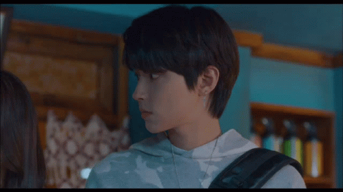 A Boy And A Girl Are Standing Next To Each Other And The Boy Is Wearing A Sweatshirt That Says Fm On It GIF