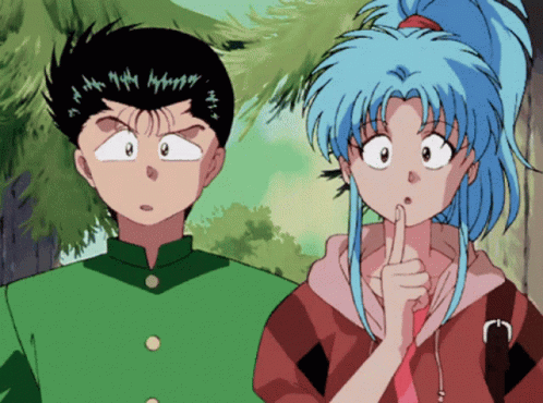 A Boy And A Girl Are Standing Next To Each Other And The Girl Has Her Finger On Her Mouth GIF