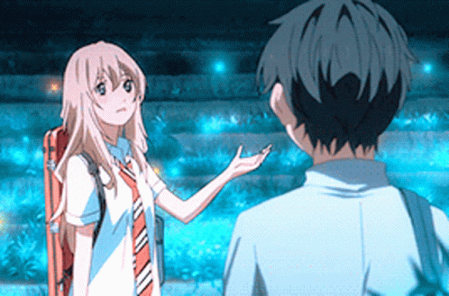 A Boy And A Girl Are Standing Next To Each Other And The Girl Is Holding Out Her Hand GIF