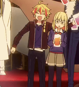 A Boy And A Girl Are Standing Next To Each Other Holding Drinks GIF