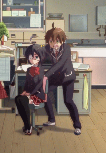 A Boy And A Girl Are Standing Next To Each Other In A Room With A Towel Hanging On The Wall GIF