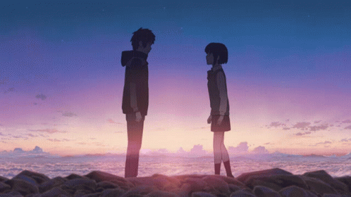 A Boy And A Girl Are Standing Next To Each Other In Front Of A Purple Sky GIF