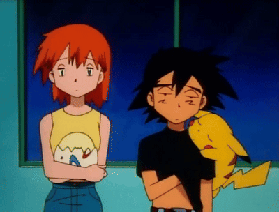 a boy and a girl are standing next to each other with a pikachu between them