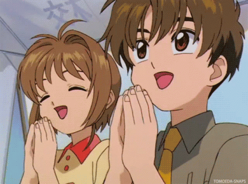 A Boy And A Girl Are Standing Next To Each Other With Their Hands Folded In Prayer GIF