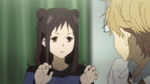 A Boy And A Girl Are Talking To Each Other In A Room . The Girl Is Looking At The Boy . GIF