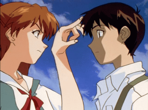 A Boy And A Girl Are Touching Their Foreheads With Their Hands GIF