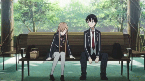 A Boy And A Girl Sit On A Park Bench GIF
