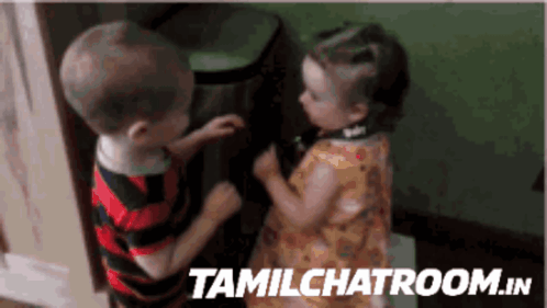 A Boy And A Girl Standing Next To Each Other With Tamilchatroom.in Written On The Bottom Right GIF