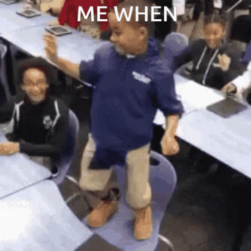 A Boy In A Blue Hoodie Is Dancing In A Classroom With The Words " Me When " On The Bottom GIF