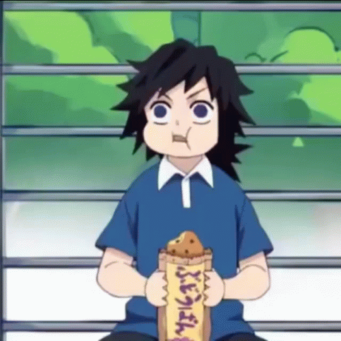 A Boy In A Blue Shirt Is Sitting On A Bench Eating A Bag Of Food . GIF