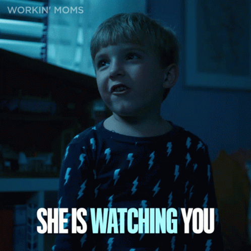a boy in a blue shirt with lightning bolts on it says " she is watching you "