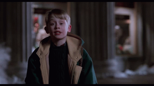 A Boy In A Jacket With The Words Sssmile On The Bottom Right GIF