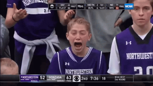 A Boy In A Purple Northwest Jersey Is Crying During A Basketball Game GIF
