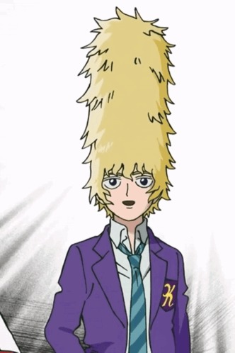 A Boy In A Purple Suit And Tie Has A K On His Chest GIF