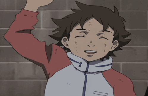 A Boy In A Red And White Jacket Is Smiling With His Hand In The Air GIF