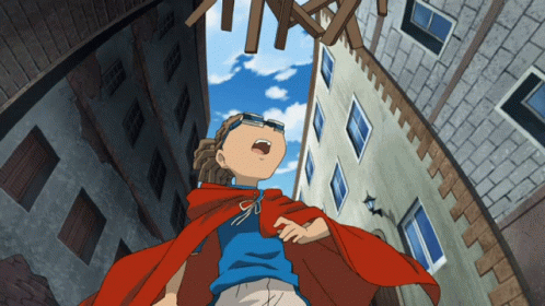 A Boy In A Red Cape And A Blue Shirt Is Looking Up At Something GIF