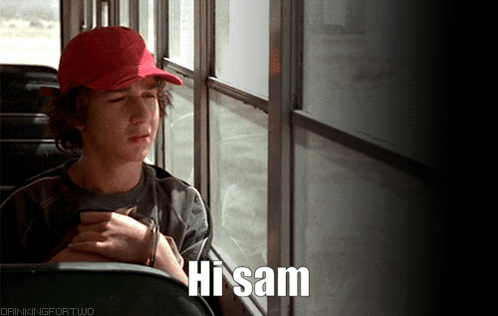 A Boy In A Red Hat Is Sitting On A Bus With The Words Hi Sam Below Him GIF