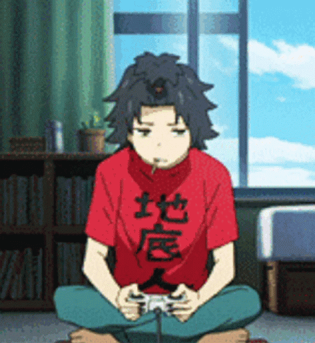 A Boy In A Red Shirt Is Sitting On The Floor Playing A Game GIF