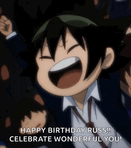 A Boy In A Suit And Tie Is Celebrating His Birthday With His Fist In The Air GIF
