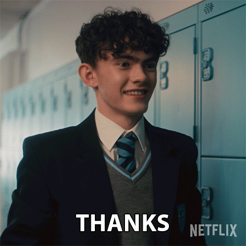 A Boy In A Suit And Tie Says Thanks GIF