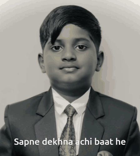 A Boy In A Suit And Tie With The Words Sapne Dekhna Achi Baat He Below Him GIF