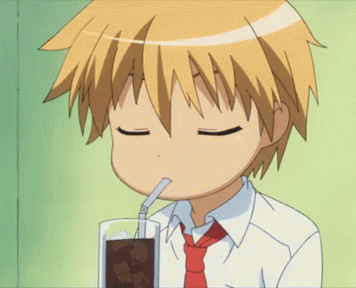 A Boy In A Tie Drinks Through A Straw GIF