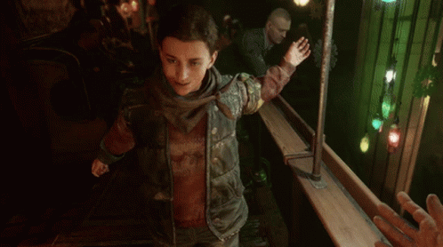 A Boy In A Video Game Is Reaching Out Towards Another Person 'S Hand GIF