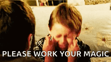 A Boy Is Covering His Face With His Hands And The Words " Please Work Your Magic " Are Next To Him . GIF
